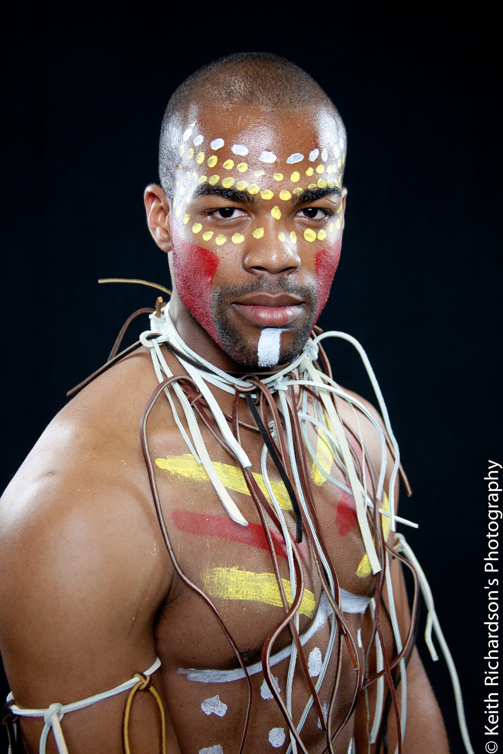 Tribal-inspired body art editorial, close crop