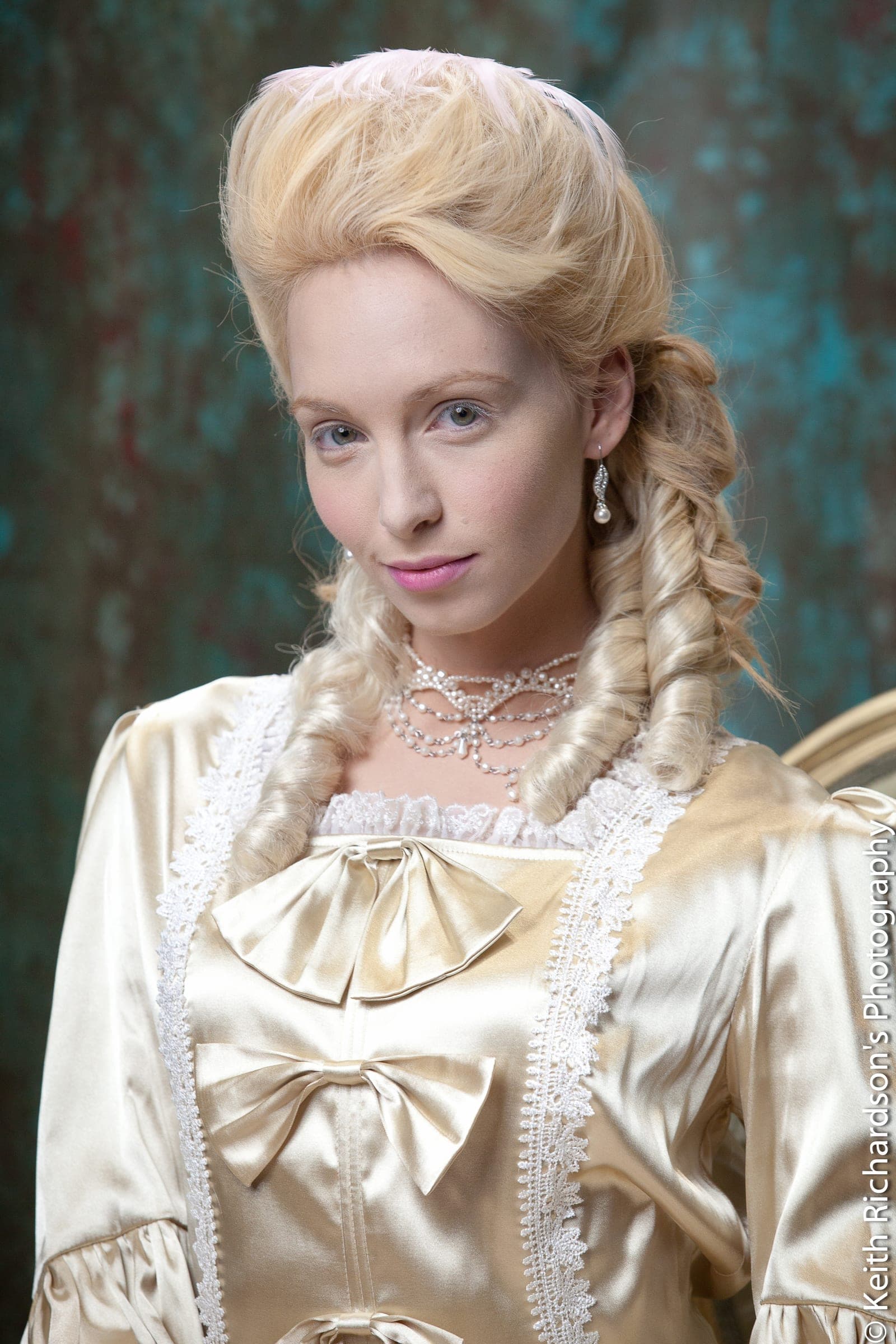 Period-inspired portrait in a gold satin gown