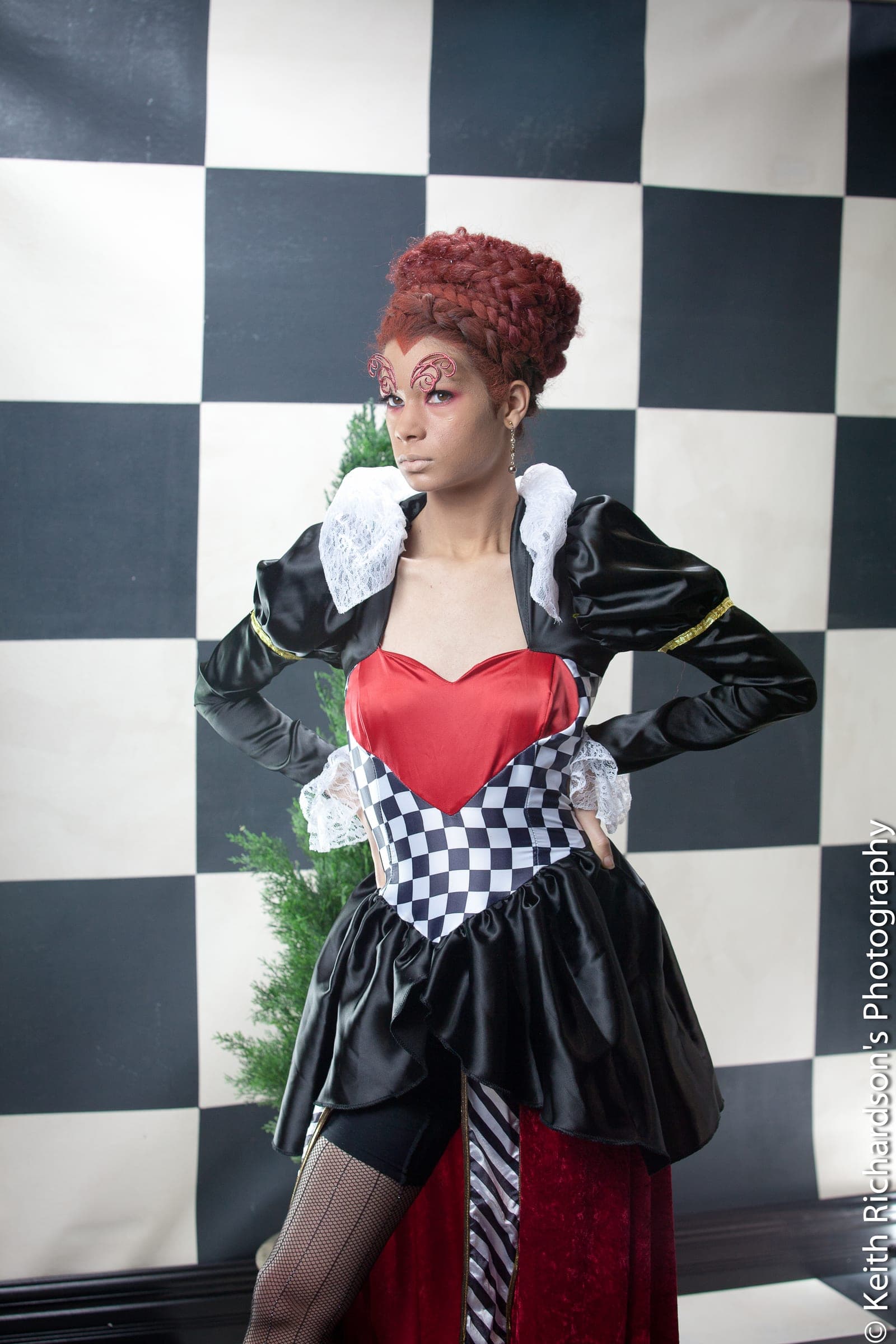 Editorial Red Queen concept portrait on checkerboard set