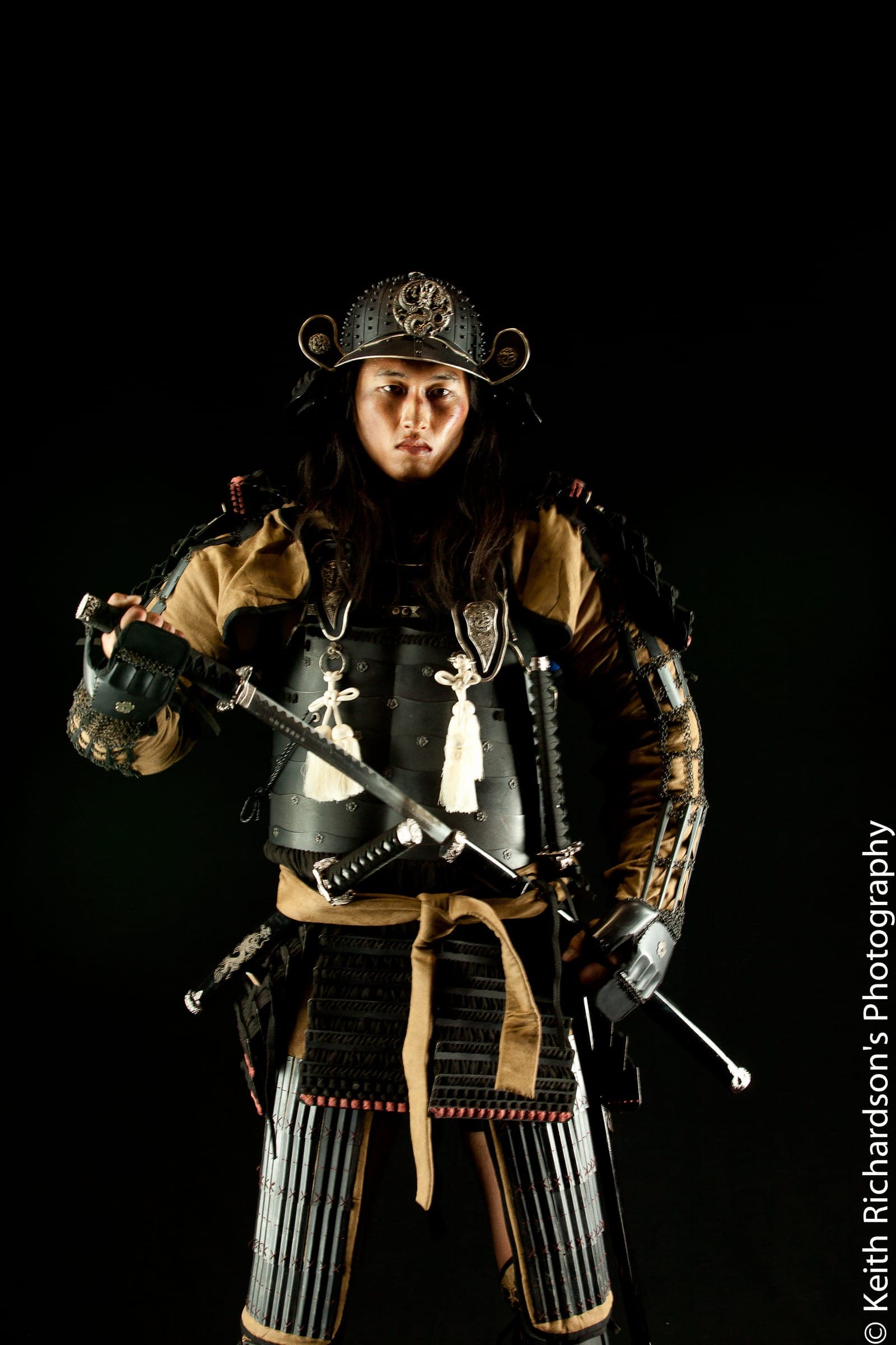 Editorial portrait in samurai armor, studio lighting